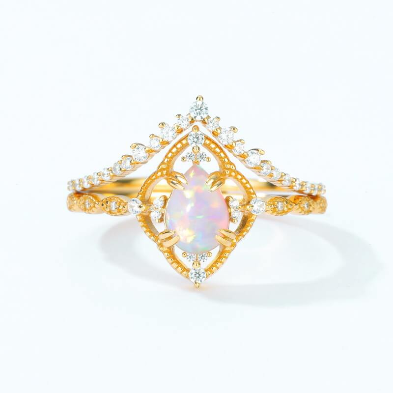 Gold opal jewelry ring set with layered bands representing harmony and emotional balance.