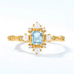 London blue topaz jewelry ring with pearls symbolising mystical elegance and lasting friendship.
