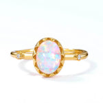 Gold opal jewelry ring showing luminous colour play symbolising authenticity and joy.