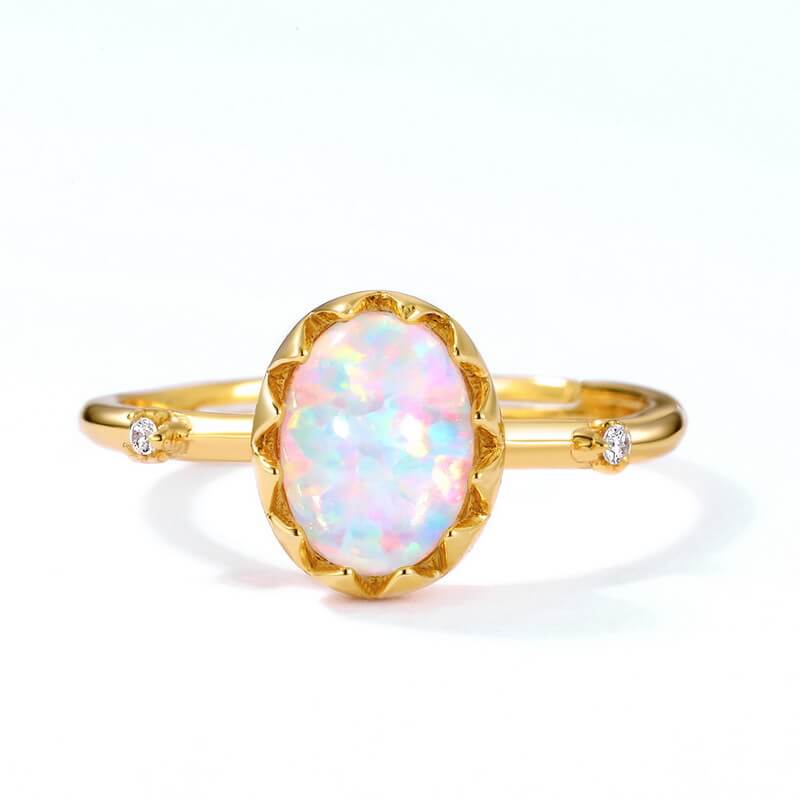 Gold opal jewelry ring showing luminous colour play symbolising authenticity and joy.