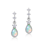 Silver teardrop opal jewelry earrings reflecting calm energy and gentle beauty.