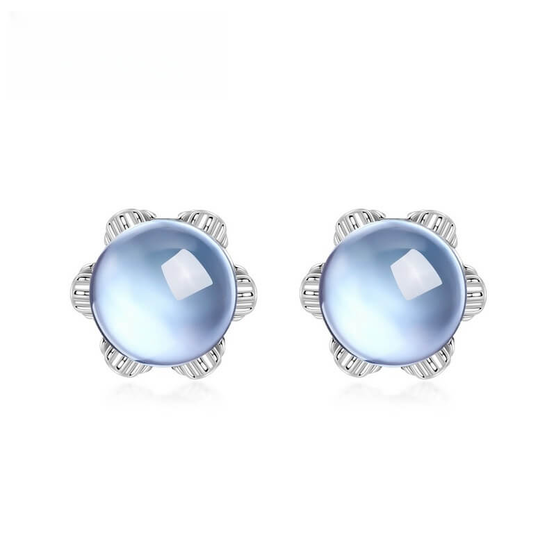 Flower-shaped sky blue topaz jewelry earrings representing softness, friendship and light.
