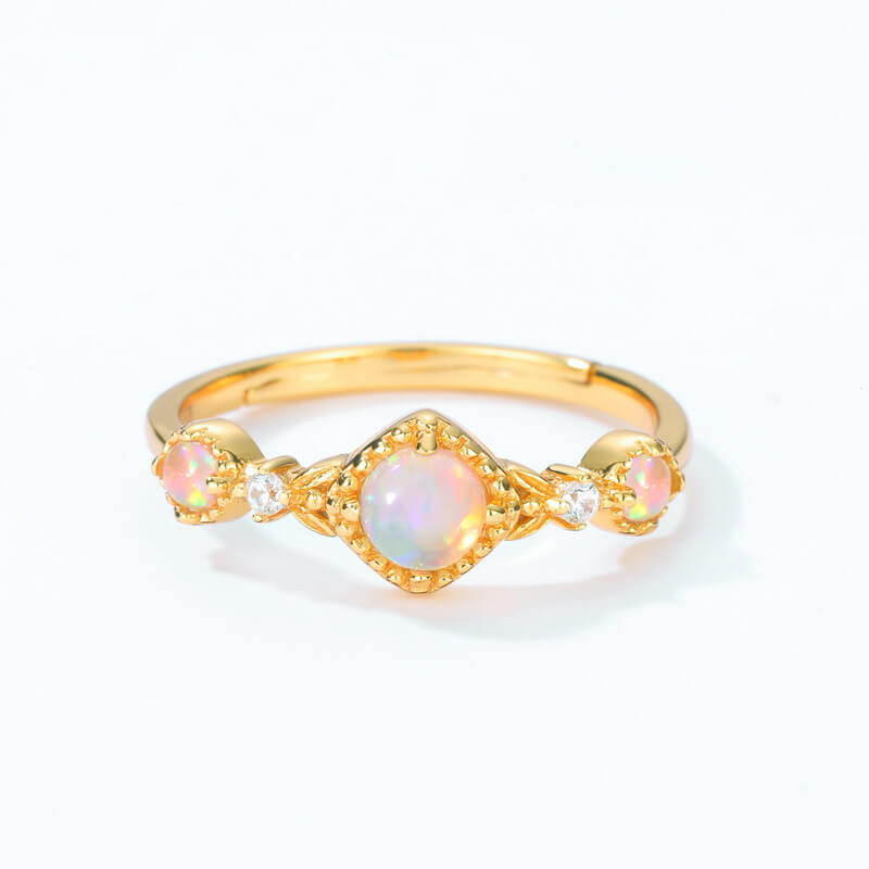 Gold opal jewelry ring inspired by the night sky, symbolising inner light and hope.