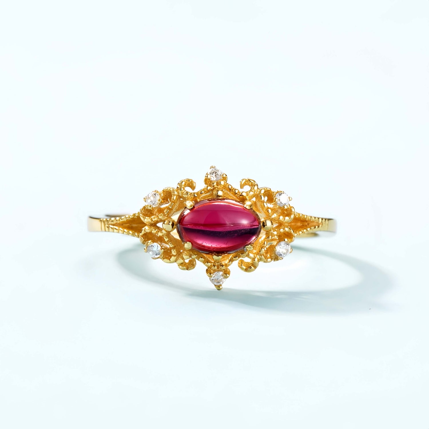 Vintage garnet necklace radiating timeless warmth and emotional strength.