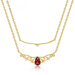 Layered garnet necklace designed for January birthstone energy of passion and renewal.