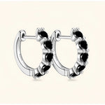 Silver black moissanite jewelry hoop earrings symbolising mystery, confidence and depth.