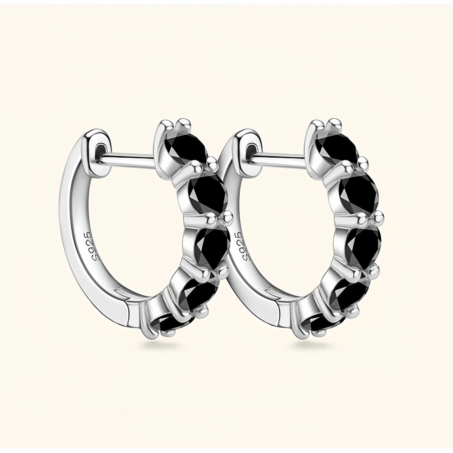 Silver black moissanite jewelry hoop earrings symbolising mystery, confidence and depth.