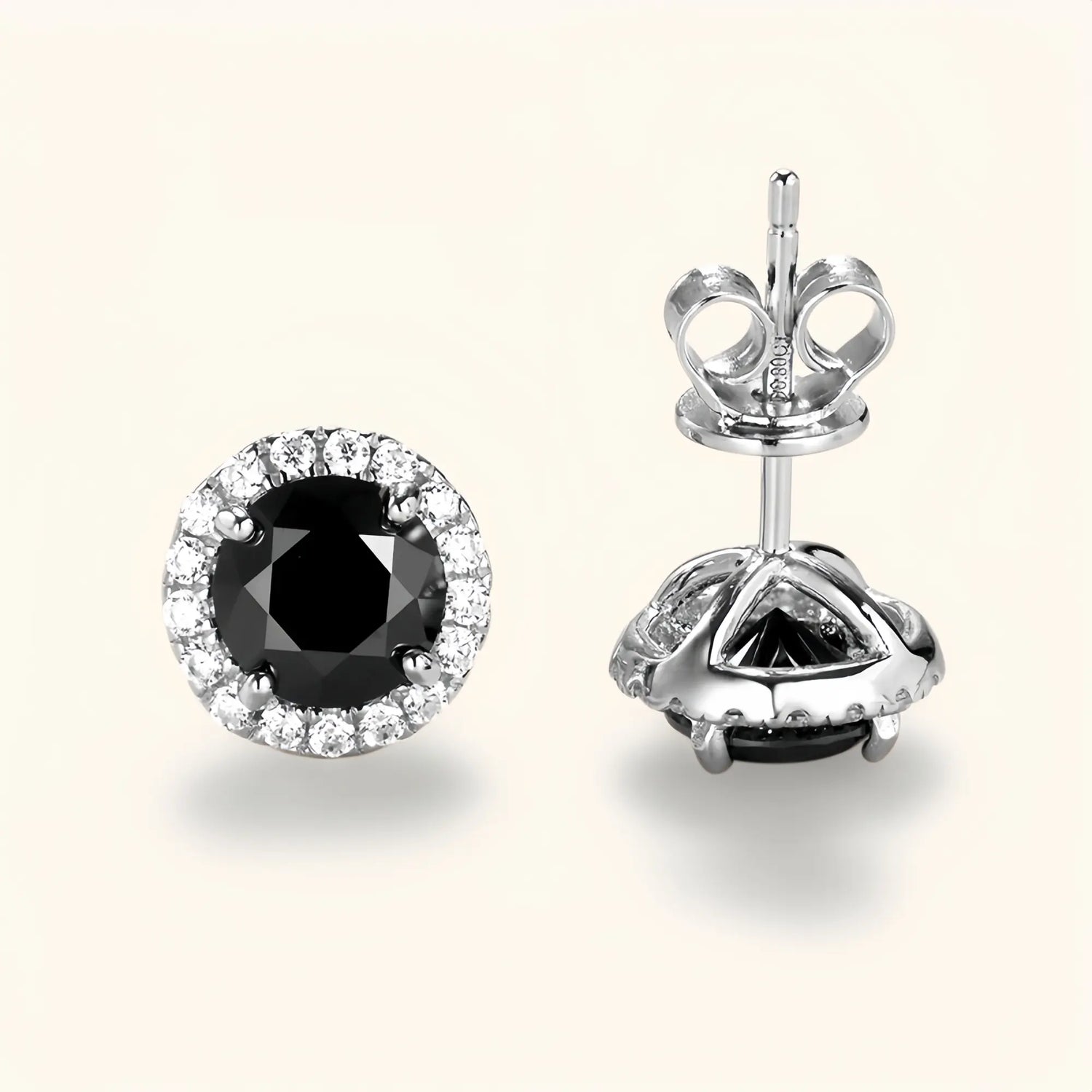 Silver black moissanite jewelry earrings with halo design representing elegance and strength.