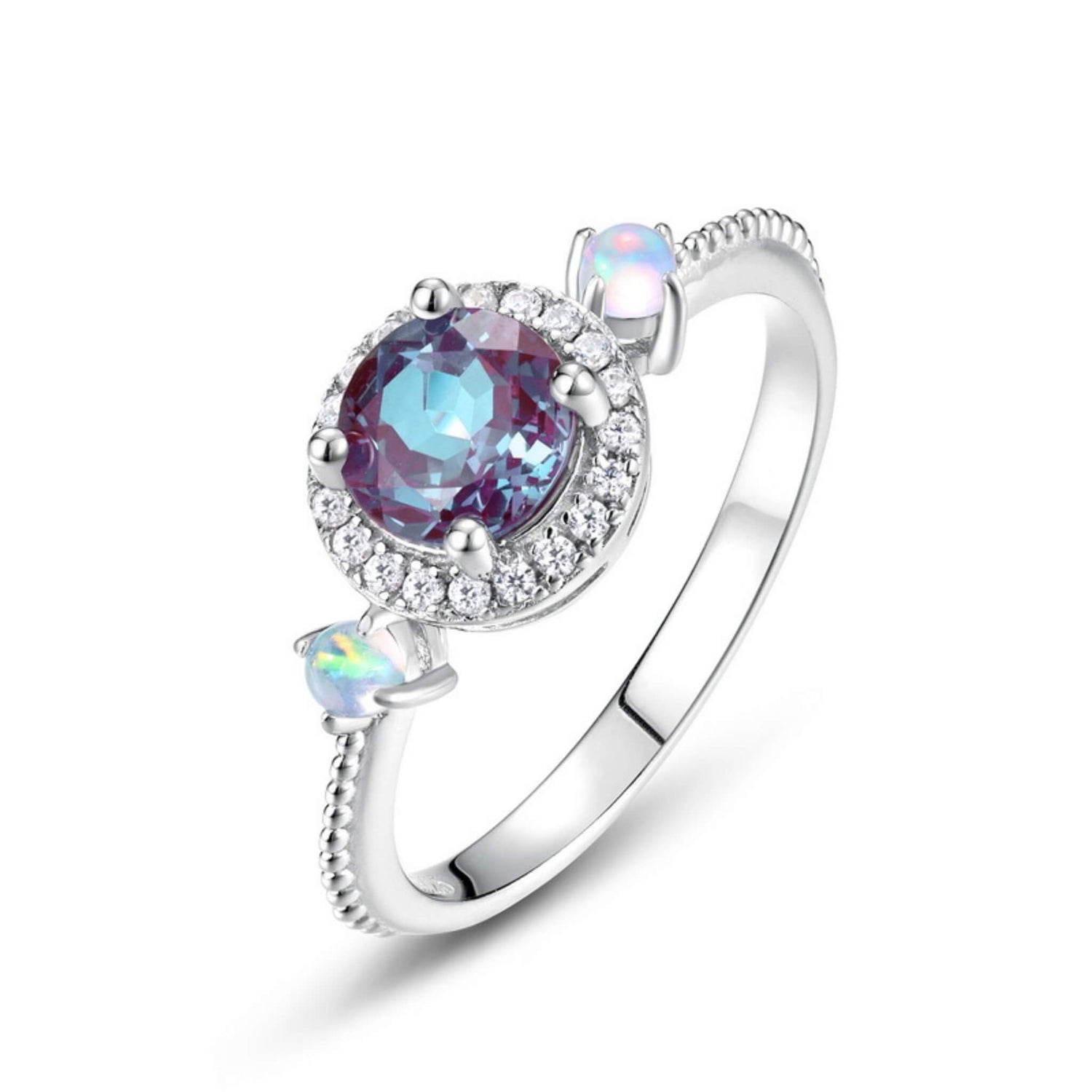Colour-changing alexandrite ring capturing duality of light and emotion, handcrafted by Minerva Jewelry.