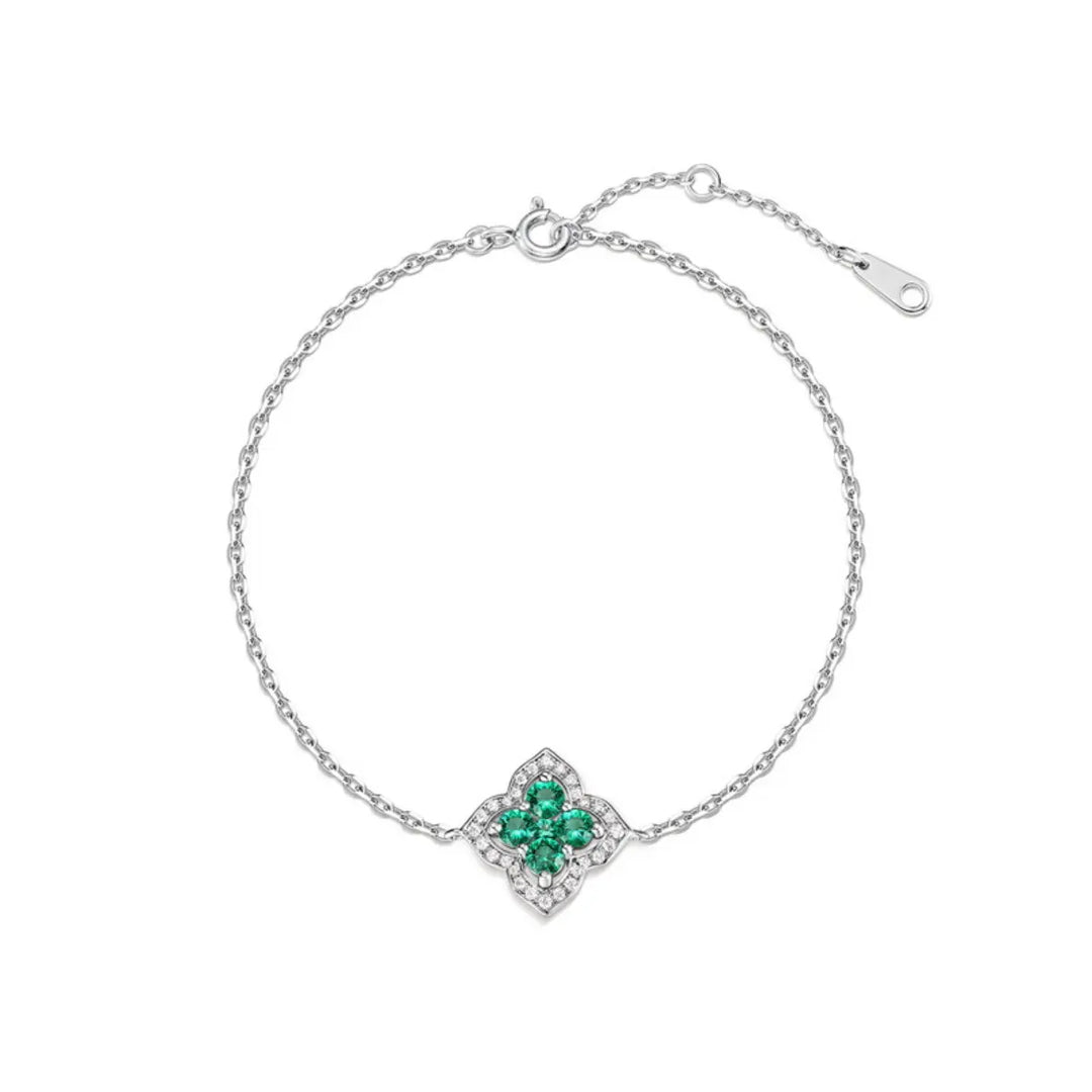 Emerald charm bracelet in sterling silver, crafted to inspire balance and beauty.
