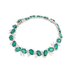 Emerald and diamond statement necklace representing confidence and refined luxury.