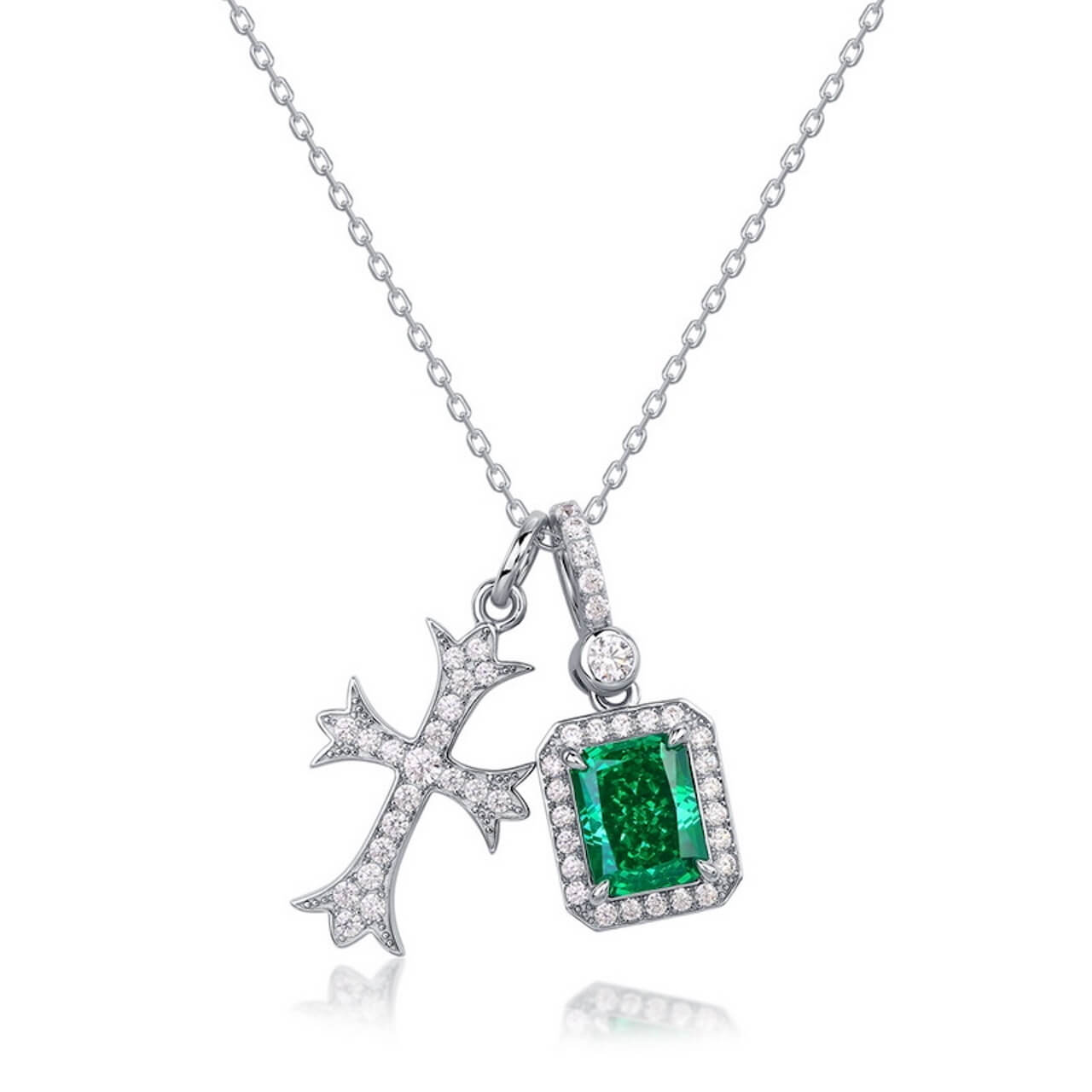 Emerald cross necklace combining faith and balance, handcrafted by Minerva Jewelry.