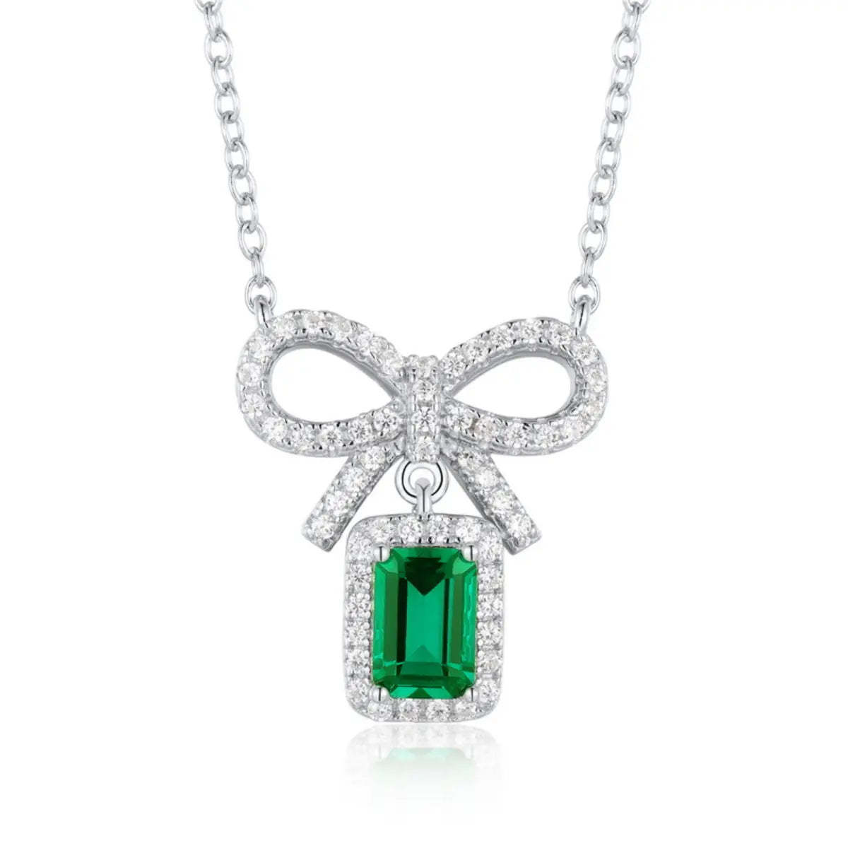 Emerald pendant necklace representing modern sophistication and spiritual growth.