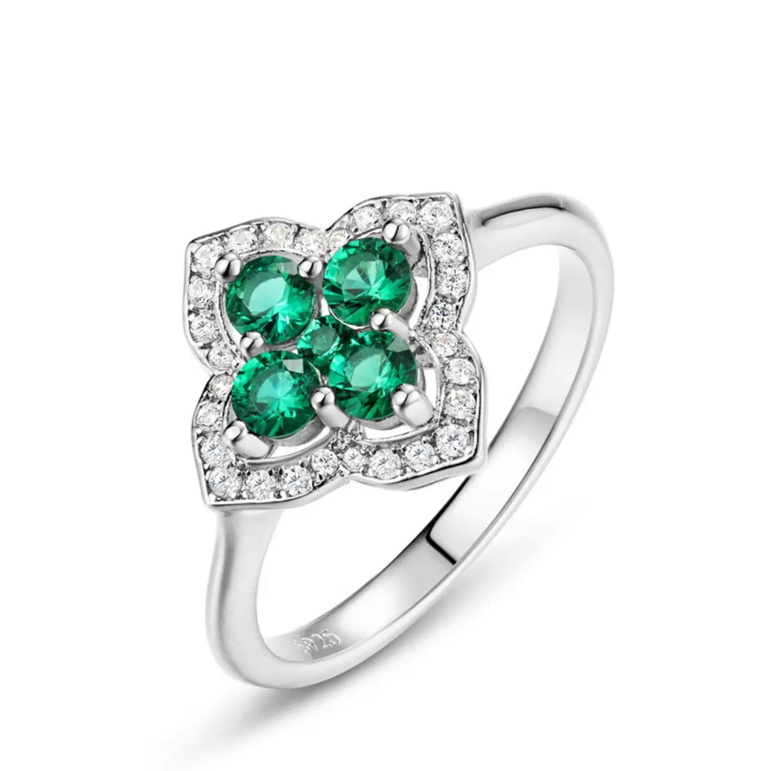 Four-leaf clover emerald ring bringing good fortune and positivity by Minerva Jewelry.