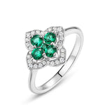 Four-leaf clover emerald ring bringing good fortune and positivity by Minerva Jewelry.