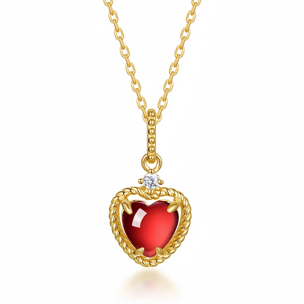 Heart-shaped garnet pendant in silver, crafted to express pure affection and calm strength.