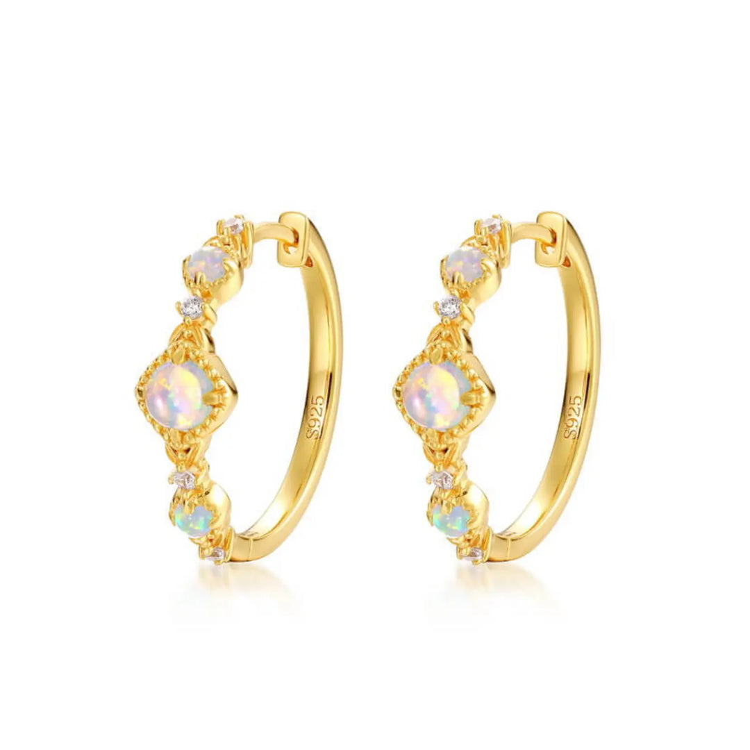 Gold halo opal jewelry earrings symbolising harmony, light and inner peace.