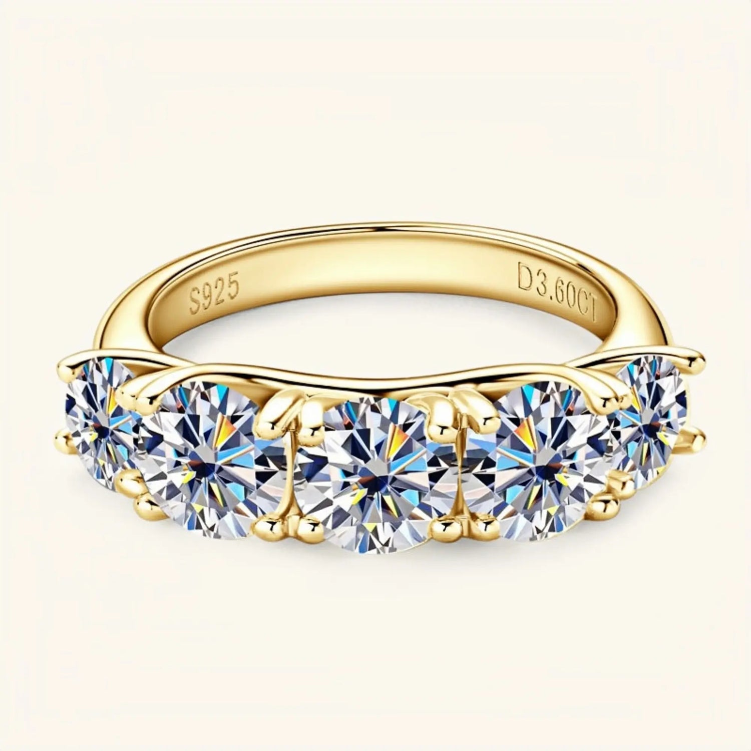 Yellow gold moissanite jewelry ring with five stones symbolising power, connection and unity.