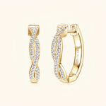 Gold moissanite twisted hoop earrings representing energy, unity and movement.