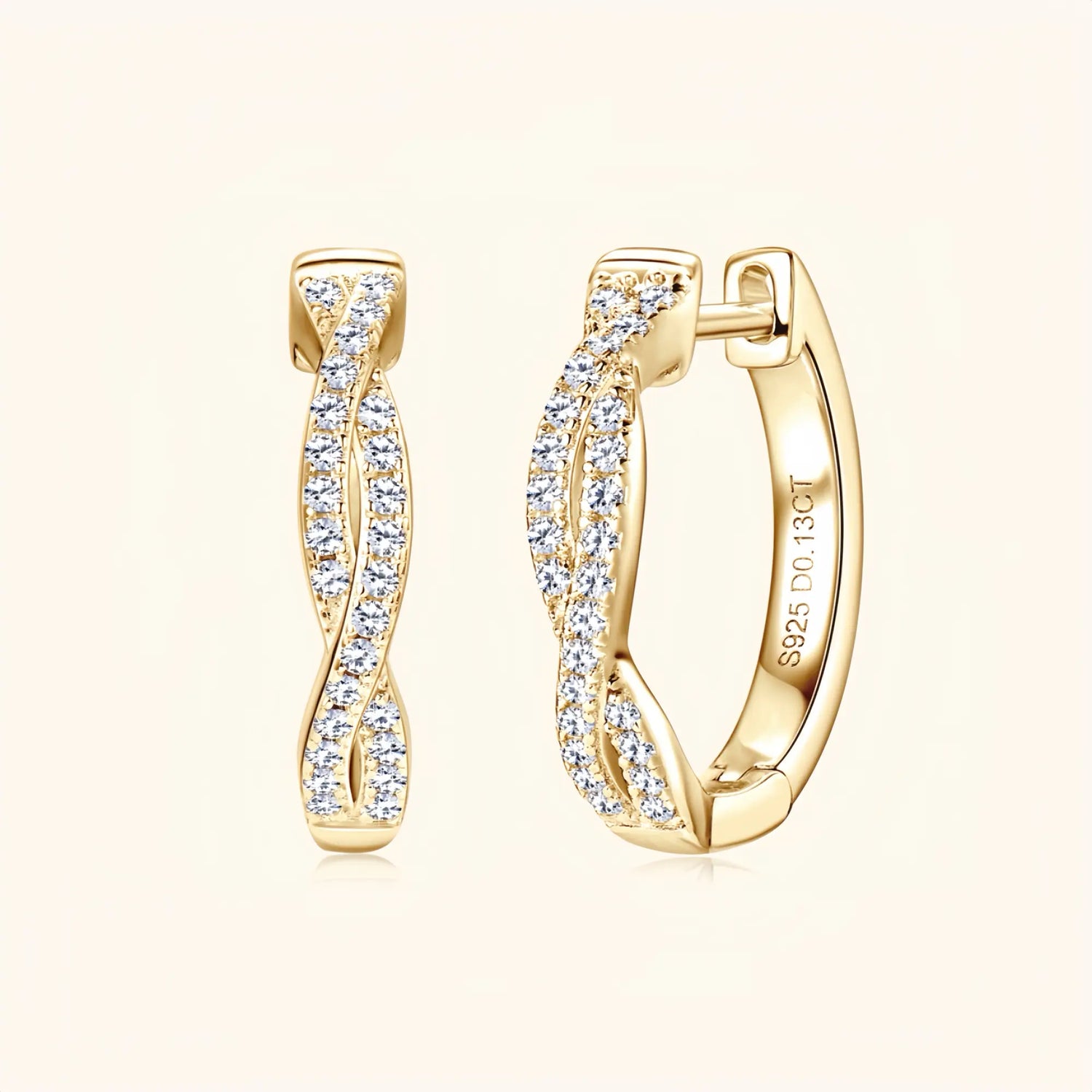 Gold moissanite twisted hoop earrings representing energy, unity and movement.