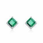 Square-cut emerald earrings designed by Minerva Jewelry, representing creativity and poise.