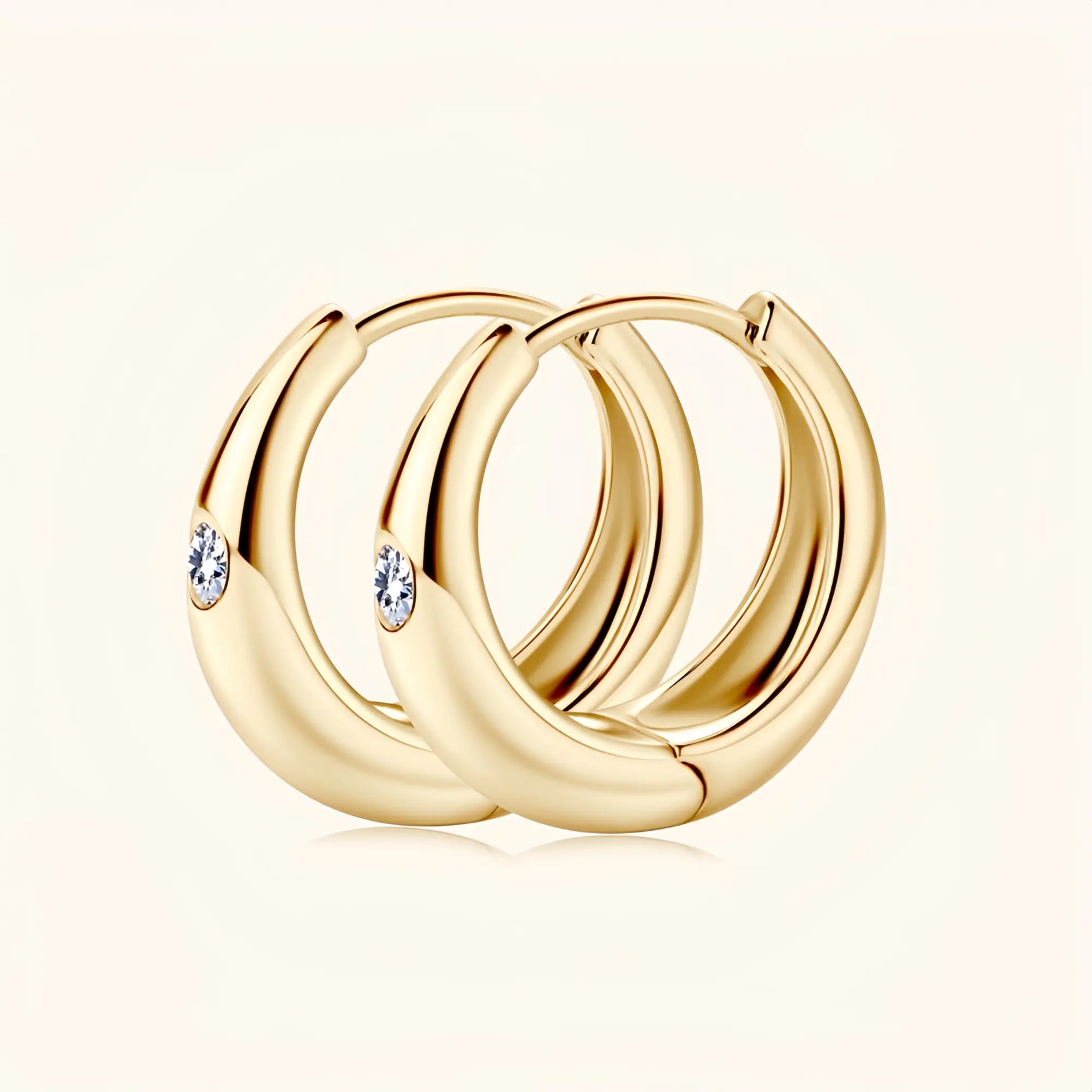 Gold moissanite hoop earrings representing harmony, confidence and enduring style.