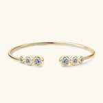 Gold moissanite jewelry cuff bracelet symbolising balance, openness and refined elegance.