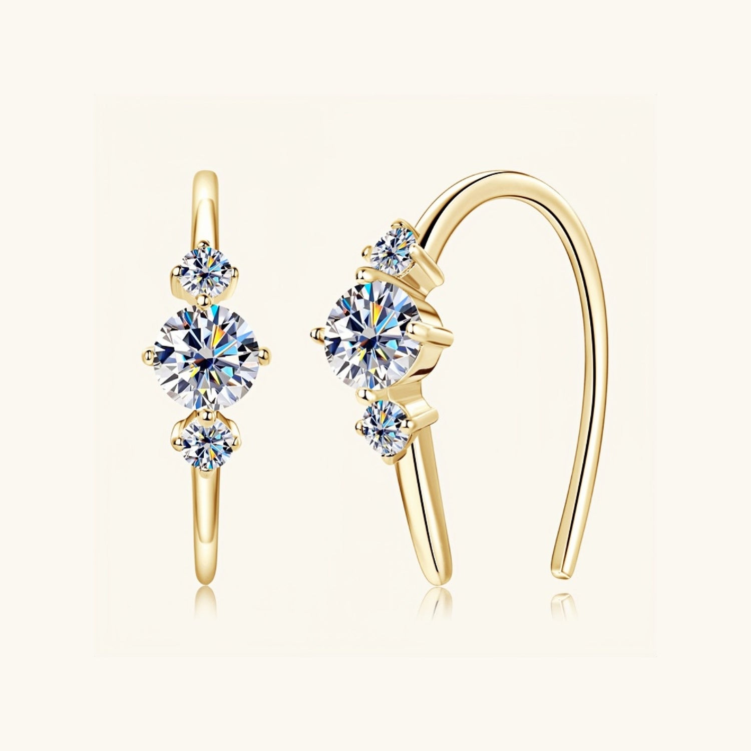 Gold moissanite jewelry earrings with three stones symbolising confidence and love.