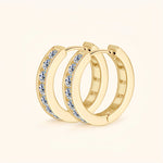 Gold moissanite pavé hoop earrings representing luxury, balance and commitment.