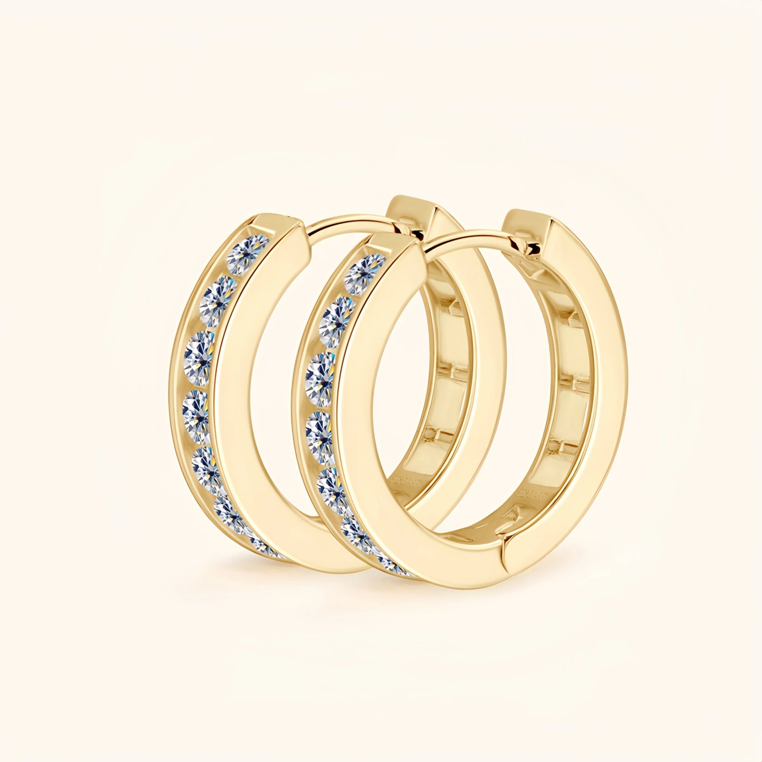 Gold moissanite pavé hoop earrings representing luxury, balance and commitment.