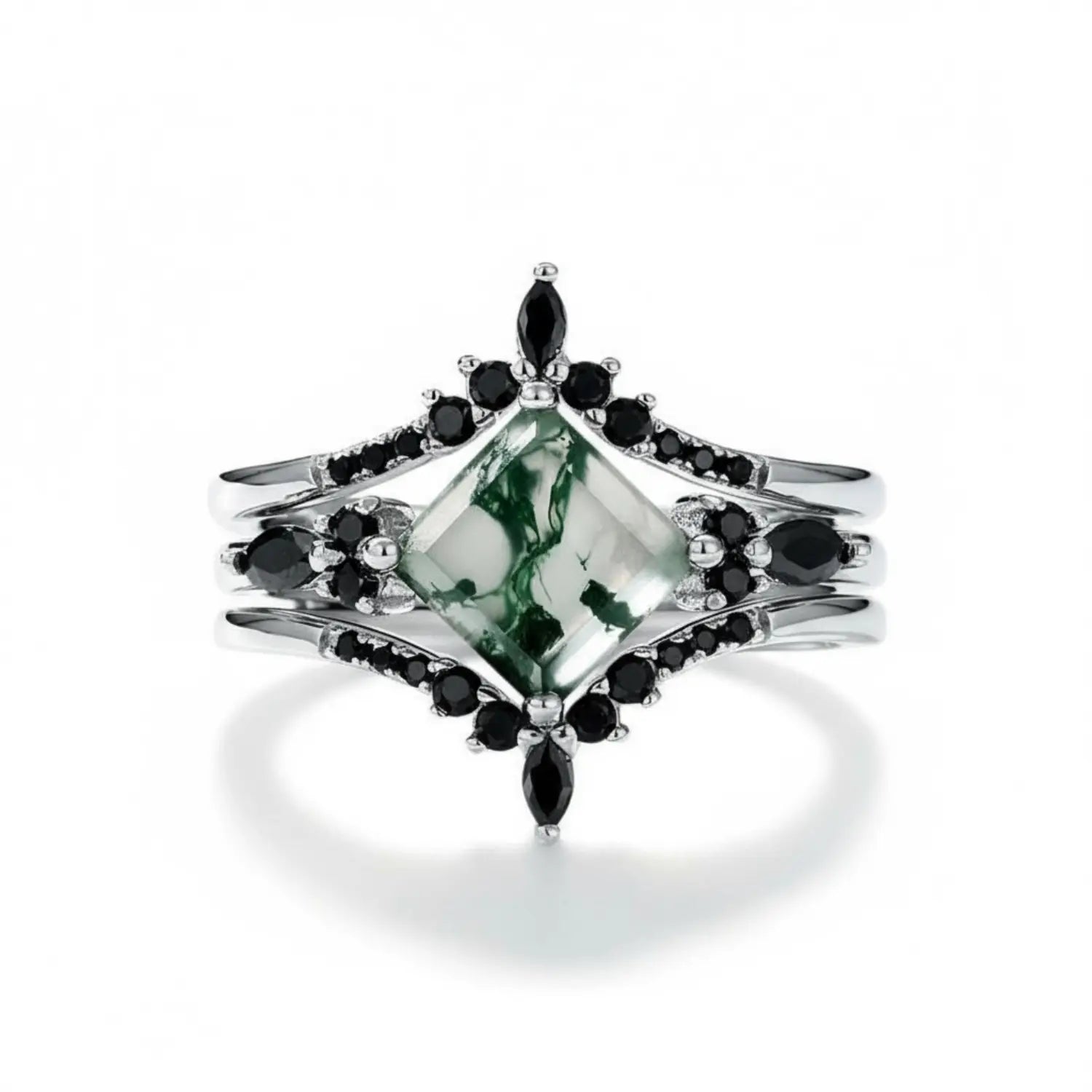 Princess-cut moss agate jewelry ring with black accents symbolising strength and focus.