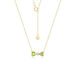 Heart-shaped peridot necklace in solid gold reflecting affection and prosperity.