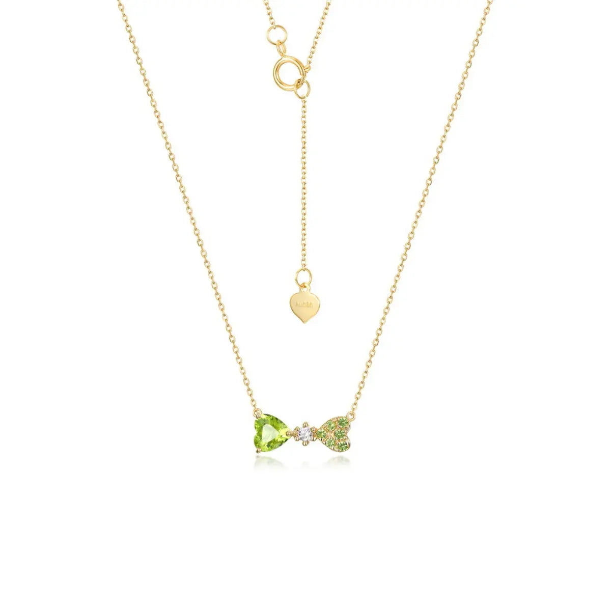 Heart-shaped peridot necklace in solid gold reflecting affection and prosperity.