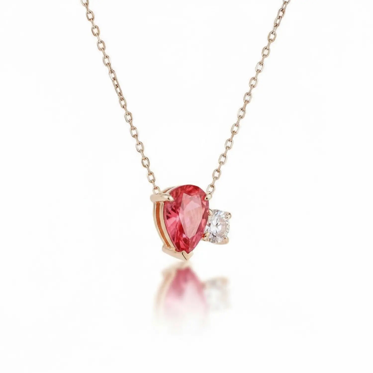 Ruby Diamond Necklace in 14K gold featuring a vivid pear-cut ruby and a bright diamond.