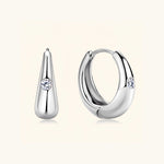 Silver moissanite hoop earrings symbolising simplicity, clarity and timeless grace.