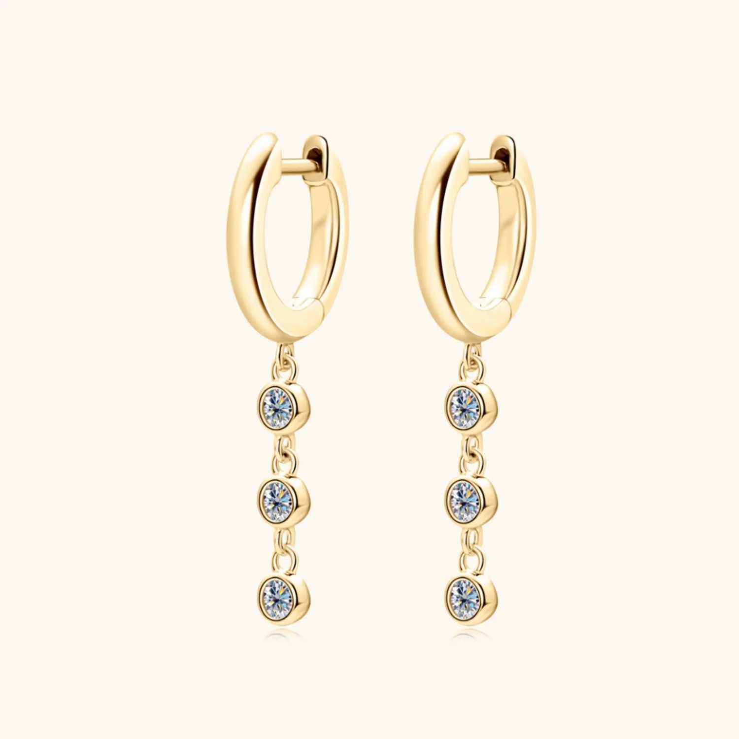 Gold moissanite hoop earrings symbolising energy, light and self-assurance.