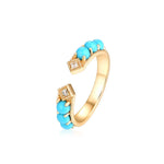 Gold turquoise jewelry engagement ring representing luck, love and positive energy.