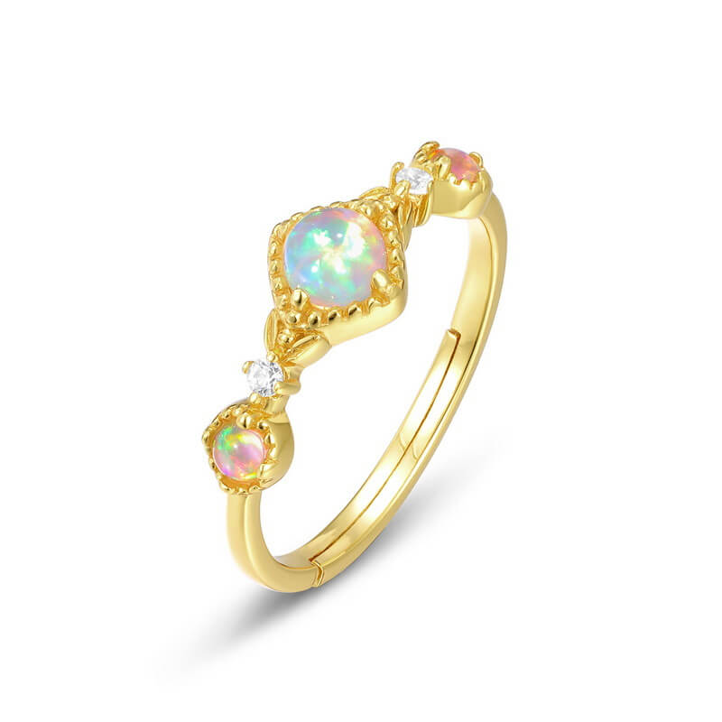 Gold opal jewelry ring inspired by the night sky, symbolising inner light and hope.