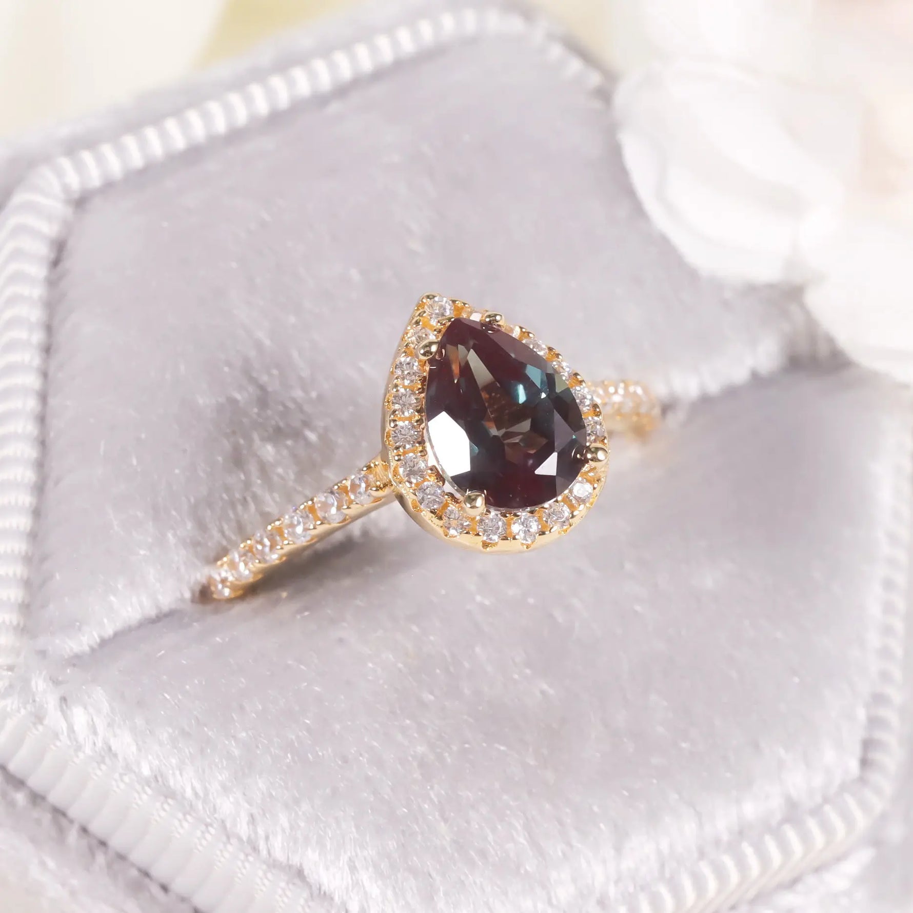 Pear-cut alexandrite engagement ring radiating harmony and devotion by Minerva Jewelry.