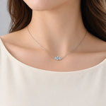 Marquise-cut moissanite necklace with the stone set horizontally between two chain ends.