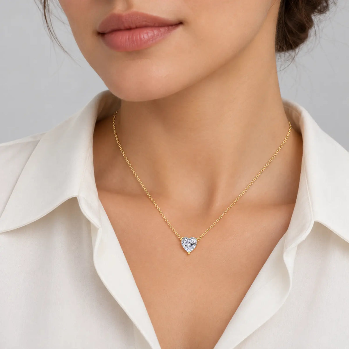 Heart-cut moissanite solitaire necklace with a fine chain attached at both sides.