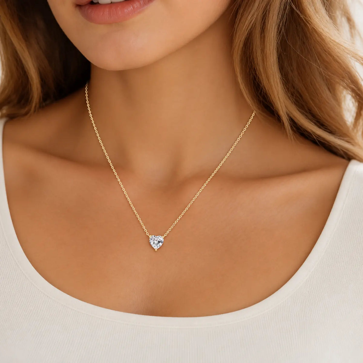 Heart-cut moissanite solitaire necklace with a fine chain attached at both sides.