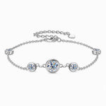 Silver tone five-stone bezel-set moissanite station bracelet