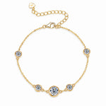 Five round moissanites spaced along a silver tone chain with a lobster clasp