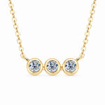 Three round moissanite stones in individual bezel settings arranged horizontally on a chain.