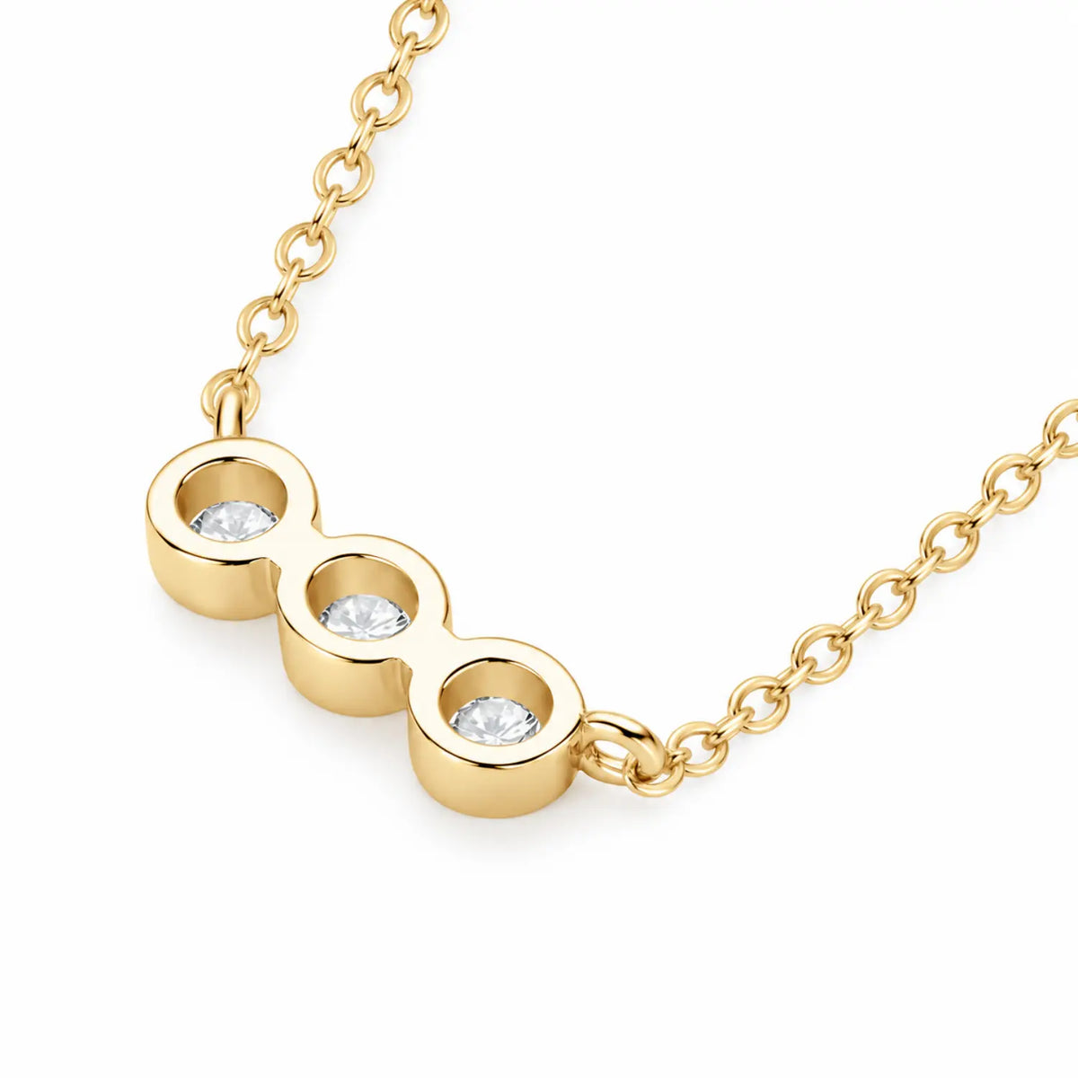 Three round moissanite stones in individual bezel settings arranged horizontally on a chain.
