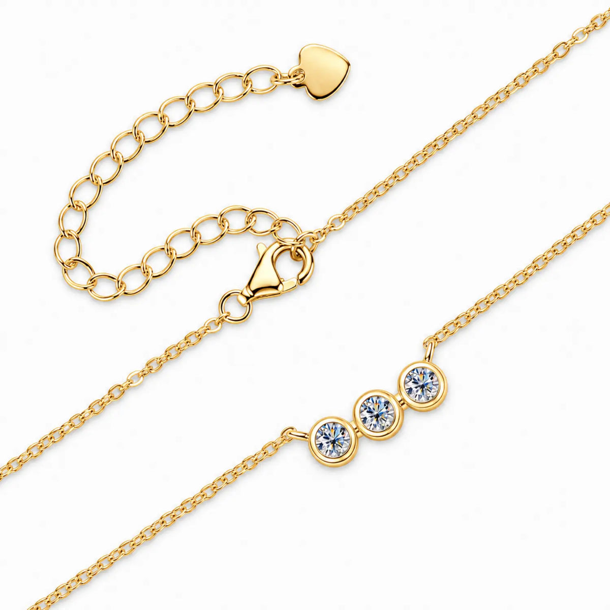 Three round moissanite stones in individual bezel settings arranged horizontally on a chain.